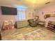 This bedroom features a large tv, a dresser, and a carpet at 11080 Jackdaw Rd, Weeki Wachee, FL 34614