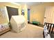This bedroom features a carpet and a mini kitchen set at 11080 Jackdaw Rd, Weeki Wachee, FL 34614