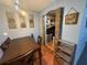 Dining room with wood table and chairs next to an archway with a safety gate at 11080 Jackdaw Rd, Weeki Wachee, FL 34614