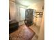 Functional basement laundry area features modern washer and dryer set with water heater and storage space at 11080 Jackdaw Rd, Weeki Wachee, FL 34614