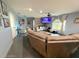 Bright living room featuring a comfortable sectional sofa and open layout at 11080 Jackdaw Rd, Weeki Wachee, FL 34614