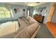 Cozy living room featuring a large sectional sofa and ample natural light at 11080 Jackdaw Rd, Weeki Wachee, FL 34614