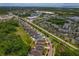 Property with a view of nearby shopping and green space with aerial views highlighting neighborhood layout at 11401 Quiet Forest Dr, Tampa, FL 33635