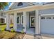 Inviting front porch with stately columns, offering a warm welcome to this delightful home at 11401 Quiet Forest Dr, Tampa, FL 33635