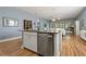 Spacious kitchen island with granite countertops and stainless steel dishwasher at 11401 Quiet Forest Dr, Tampa, FL 33635