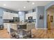 Modern kitchen with granite countertops, stainless steel appliances, and a spacious center island at 11401 Quiet Forest Dr, Tampa, FL 33635