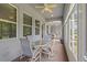 Extended sunroom with lots of natural light, fan, skylight, and two seating areas at 11401 Quiet Forest Dr, Tampa, FL 33635