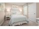 Comfortable bedroom featuring soft pastel decor, cozy bedding, and natural light for a relaxing retreat at 11410 Spectacled Dr, New Port Richey, FL 34654