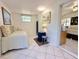 Cozy bedroom with daybed, elegant decor, and tile flooring at 11631 Bayonet Ln, New Port Richey, FL 34654