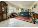 Inviting living room with elegant decor, large mirror, and ample natural light at 11631 Bayonet Ln, New Port Richey, FL 34654