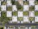 Aerial view showcasing the community layout with well-maintained green spaces and assigned parking at 11821 Boynton Ln, New Port Richey, FL 34654