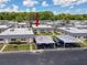 Aerial view showcasing well-maintained residential community with assigned parking and landscaping at 11821 Boynton Ln, New Port Richey, FL 34654
