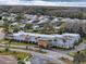 Aerial view of the community center surrounded by houses and green areas at 11821 Boynton Ln, New Port Richey, FL 34654