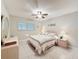 Bedroom showcasing comfortable bed, dresser and window with blinds at 11821 Boynton Ln, New Port Richey, FL 34654