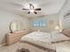 Comfortable bedroom with a ceiling fan, neutral walls, and a matching dresser and mirror set at 11821 Boynton Ln, New Port Richey, FL 34654