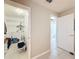 Walk-in closet and bathroom entrance in the hallway of a home at 11821 Boynton Ln, New Port Richey, FL 34654