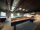 Game room with shuffleboard and pool tables at 11821 Boynton Ln, New Port Richey, FL 34654