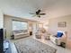 Inviting living area with a view into the dining room, comfortable seating and neutral colors at 11821 Boynton Ln, New Port Richey, FL 34654