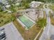 Aerial view of outdoor shuffleboard courts with surrounding parking and green spaces, combining leisure and accessibility at 11821 Boynton Ln, New Port Richey, FL 34654