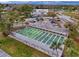 Aerial view of shuffleboard courts with covered seating and surrounding green space at 11821 Boynton Ln, New Port Richey, FL 34654