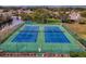 Overhead view of two well-maintained community tennis courts with new surfacing at 11821 Boynton Ln, New Port Richey, FL 34654