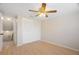 Bedroom featuring light-colored hardwood floors, ceiling fan, and a closet at 12106 Bear Creek Ln, Hudson, FL 34667