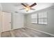 Bedroom featuring wood-look flooring and a closet at 12106 Bear Creek Ln, Hudson, FL 34667