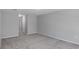Spacious bedroom featuring neutral walls and carpet flooring at 12192 Eskimo Curlew Rd, Weeki Wachee, FL 34614
