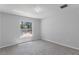 Bright bedroom features a large window offering a pleasant outdoor view at 12192 Eskimo Curlew Rd, Weeki Wachee, FL 34614