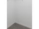 An empty walk-in closet with carpeting, ready for customization to suit your storage needs at 12192 Eskimo Curlew Rd, Weeki Wachee, FL 34614