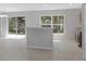 Modern kitchen island featuring stainless steel appliances and an open layout with ample natural light at 12192 Eskimo Curlew Rd, Weeki Wachee, FL 34614
