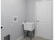 Bright laundry room features new washer hookups and a utility sink at 12192 Eskimo Curlew Rd, Weeki Wachee, FL 34614