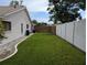 Spacious backyard with well-maintained lawn and a combination of wood and vinyl privacy fencing at 1221 Etta Ave, Spring Hill, FL 34609
