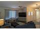 Comfortable living room with bright natural light, vaulted ceiling, ceiling fan, and views into the entry hallway at 1221 Etta Ave, Spring Hill, FL 34609