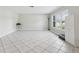 Open bonus room offers bright natural light with tile flooring and plenty of room to move around at 1222 Huntington Ave, Spring Hill, FL 34609