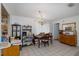 Charming dining area with a chandelier, wooden table, and ample storage at 12250 Lacey Dr, New Port Richey, FL 34654
