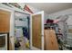 Pass through Laundry area with ample storage and a doorway leading to the other rooms at 12250 Lacey Dr, New Port Richey, FL 34654