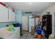 Bright laundry room with abundant cabinet space and essential appliances, perfect for efficient home management at 12250 Lacey Dr, New Port Richey, FL 34654