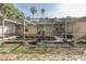 Backyard pool within a screened enclosure, promising a private and refreshing outdoor retreat at 12250 Lacey Dr, New Port Richey, FL 34654