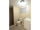 Neat bathroom complete with toilet, vanity, window, and stand up shower at 12411 Yorktown Ln, Hudson, FL 34667
