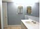 Bathroom with a vanity, single sink, and mirrors at 12411 Yorktown Ln, Hudson, FL 34667