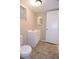 Bathroom with a single sink vanity and adjacent toilet at 12411 Yorktown Ln, Hudson, FL 34667