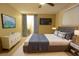 Modern bedroom featuring a plush bed, flat screen TV, and ensuite bathroom at 12411 Yorktown Ln, Hudson, FL 34667