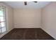 Spacious bedroom featuring a window and carpeted floors at 12411 Yorktown Ln, Hudson, FL 34667