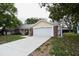 Well-maintained one-story home with lush front yard, long driveway and two car garage at 12411 Yorktown Ln, Hudson, FL 34667