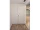 Hallway entrance showing tile floors leading to other rooms, with a glimpse of an interior space at 12411 Yorktown Ln, Hudson, FL 34667