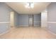 Neutral living room offering tile flooring, fresh paint, and a ceiling light fixture at 12411 Yorktown Ln, Hudson, FL 34667