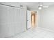 Bright bedroom featuring a ceiling fan, a neutral paint scheme, and a large closet at 13003 Sandburst Ln, Hudson, FL 34667