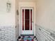 Close up of front door with decorative glass and sidelights, complemented by a 'Welcome' mat at 13003 Sandburst Ln, Hudson, FL 34667