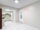 Bright kitchen with white appliances, tile floors, and ample cabinet space at 13003 Sandburst Ln, Hudson, FL 34667